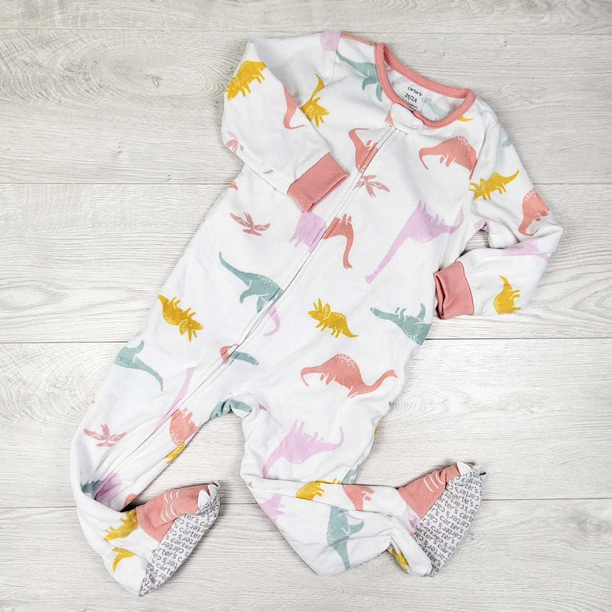Carters white zippered fleece dinosaur print sleeper. Size 2T