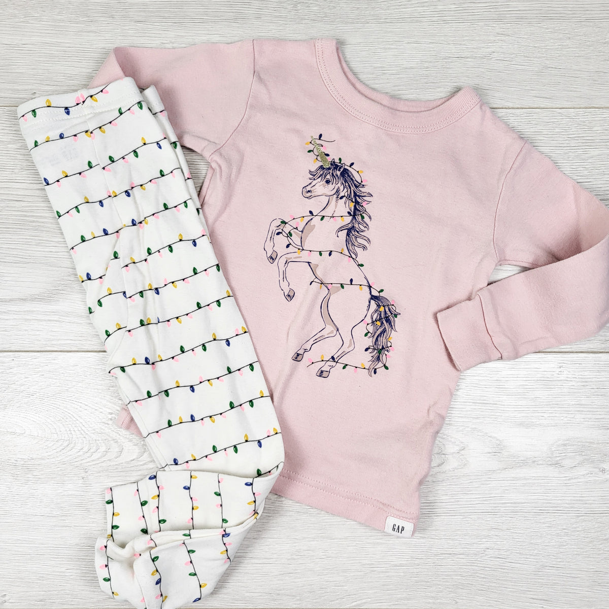 Gap pink and white 2pc PJs with holiday lights and unicorns. Size 18-24 months