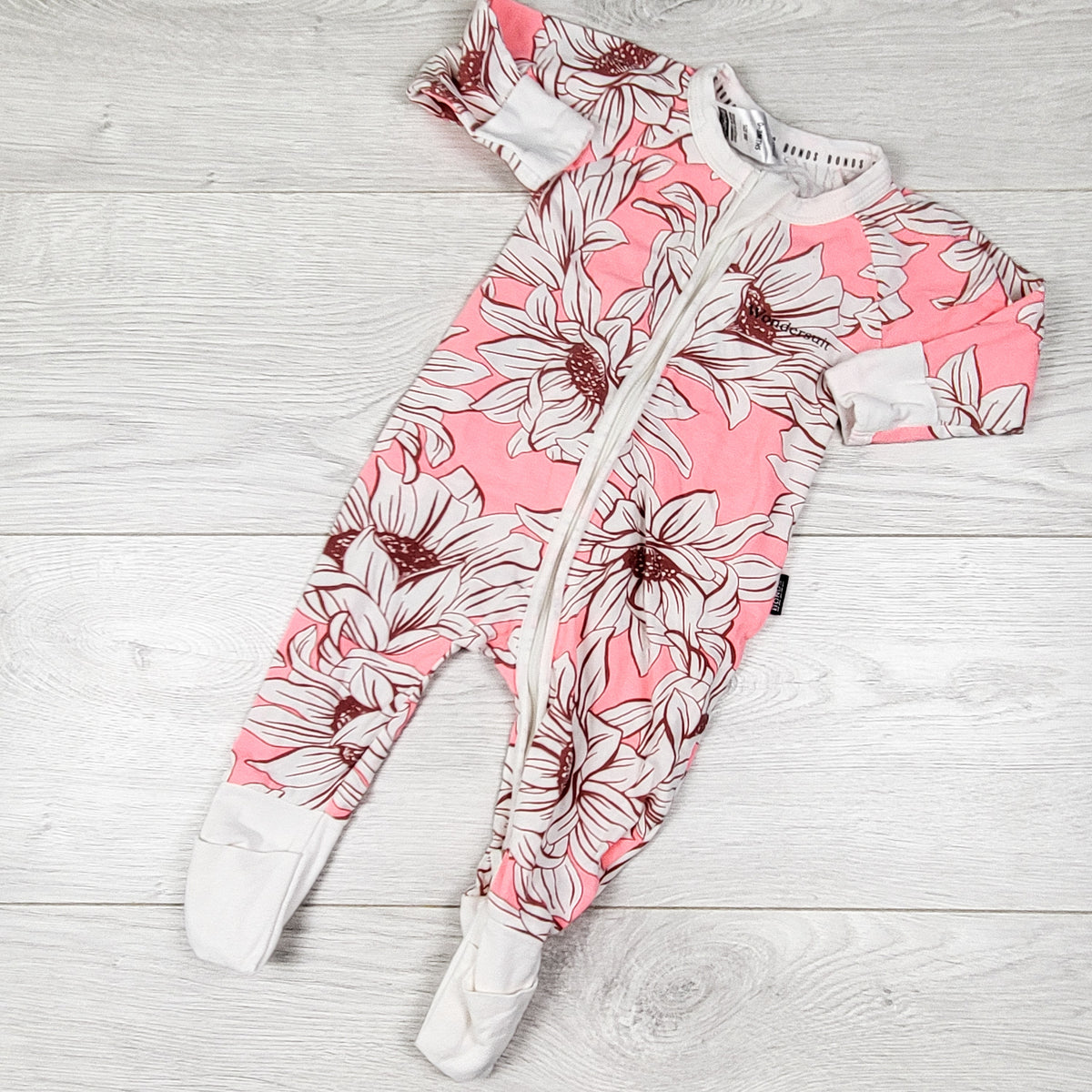 Bonds pink and white floral print zippered wondersuit sleeper. Size 0-3 months
