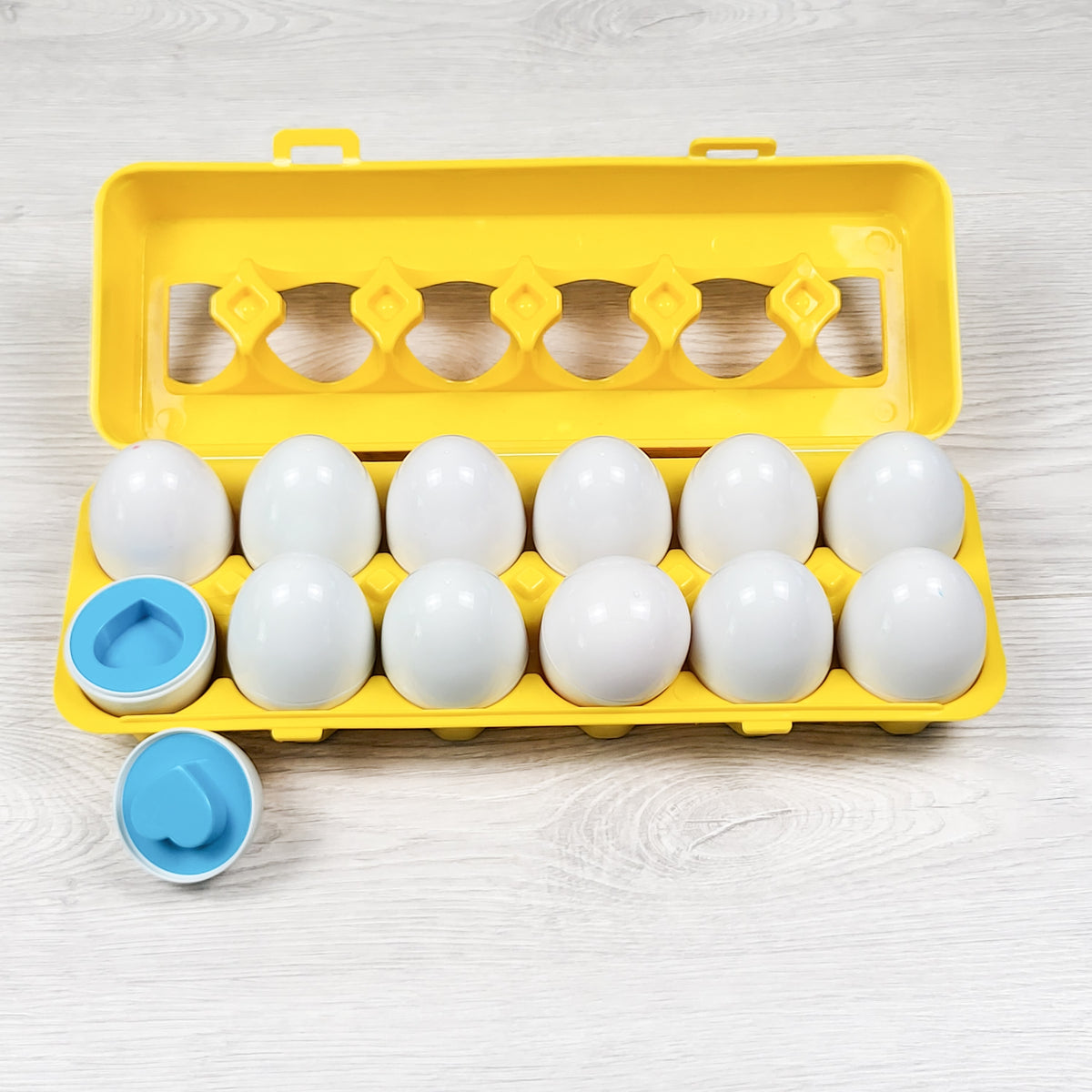 Shape matching egg carton toy