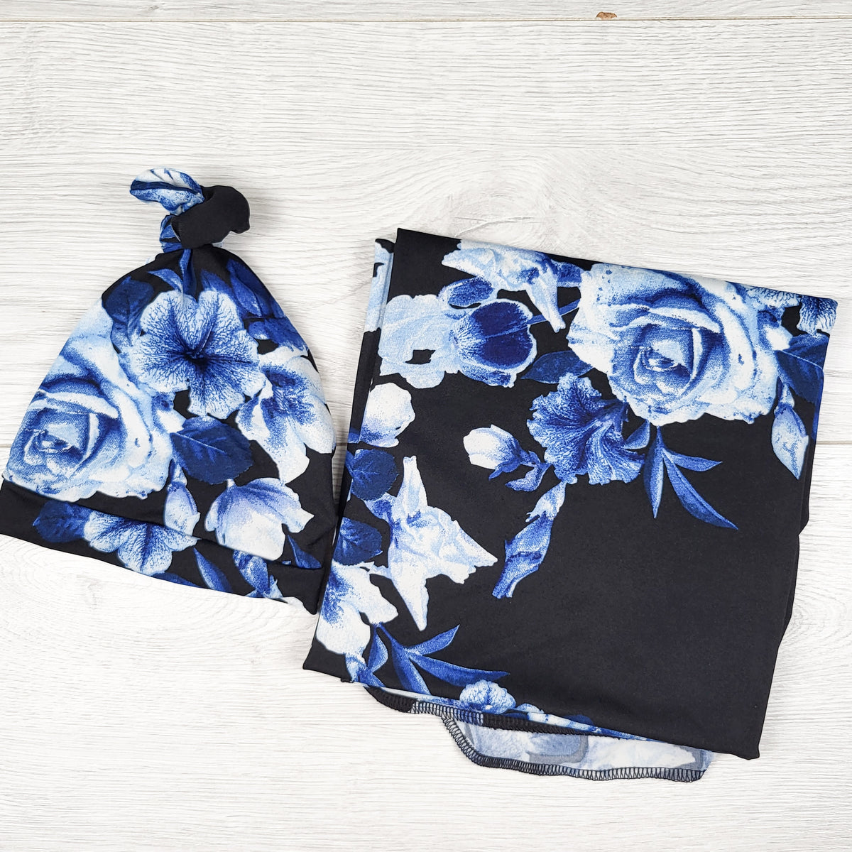 Black and blue floral print swaddle with matching hat