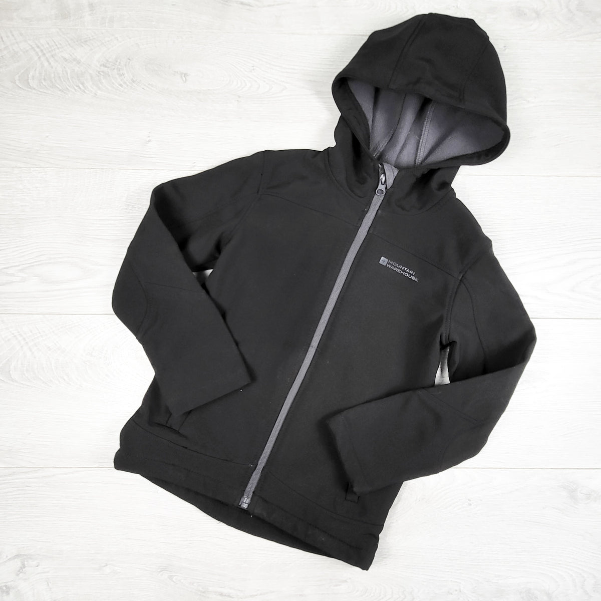 Mountain Warehouse black fleece lined soft shell rain jacket. Size 5/6
