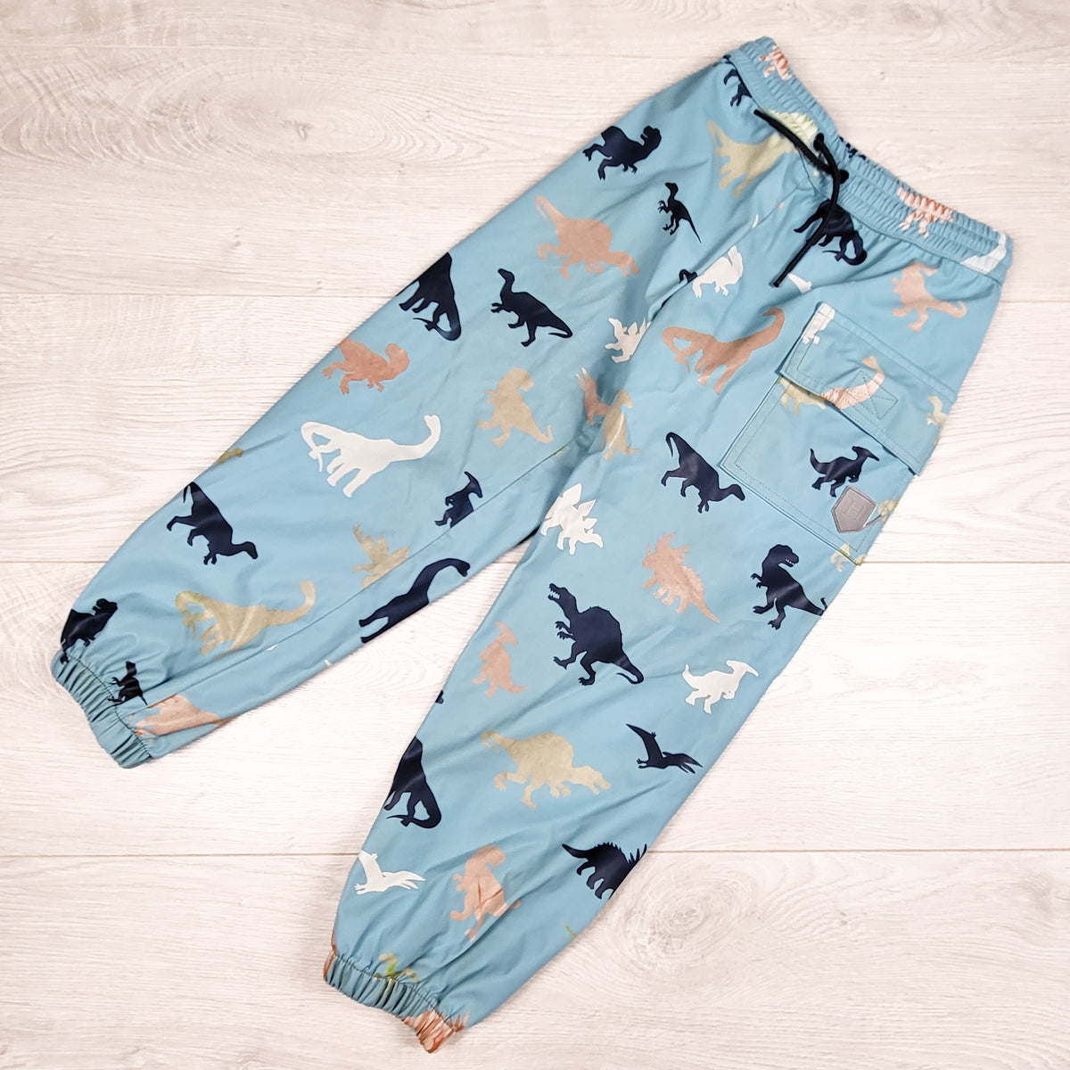 Hatley blue dinosaur print colour changing rain pants. Size 5T - AS IS