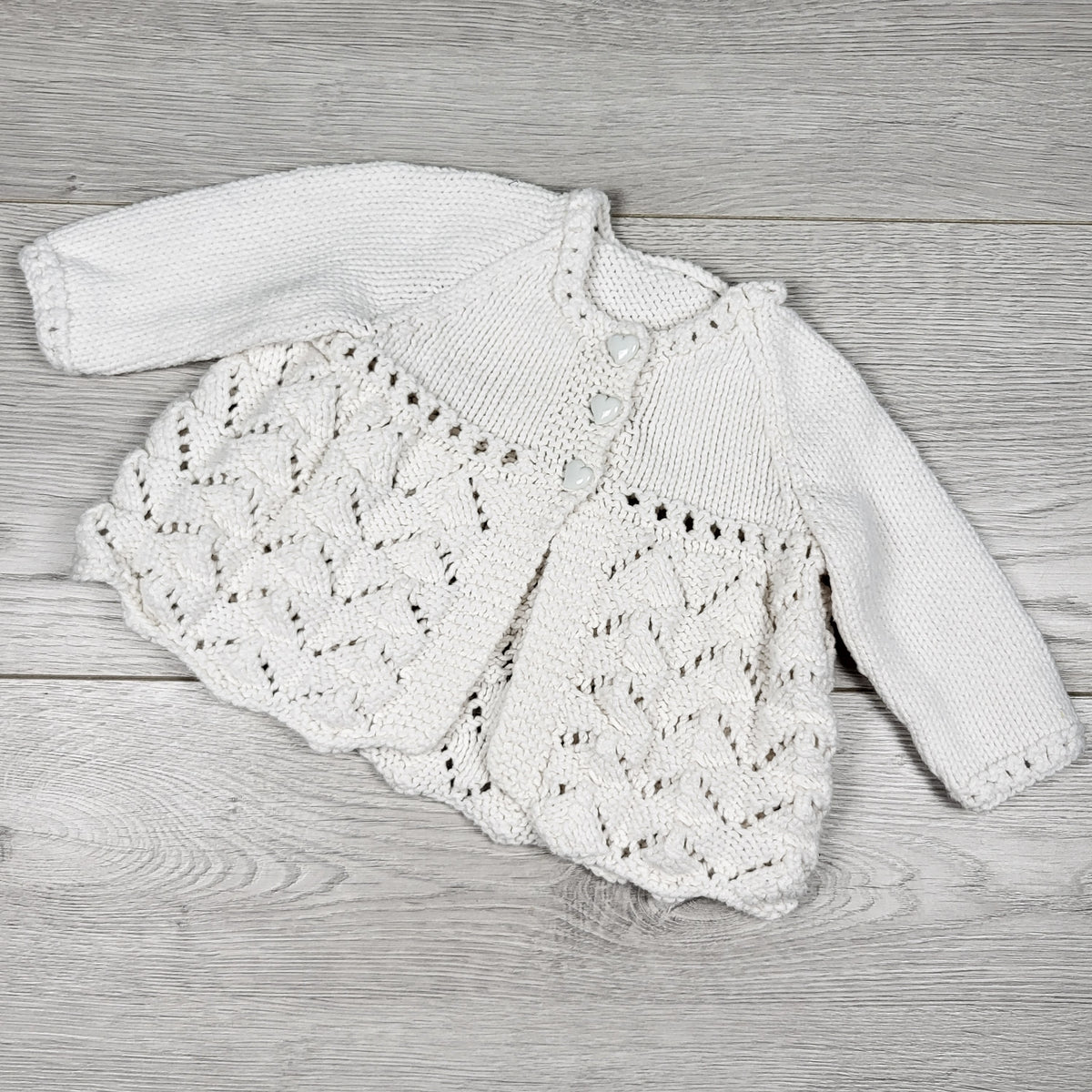 White handmade open knit cardigan sweater with heart buttons. Approx 0-3 months
