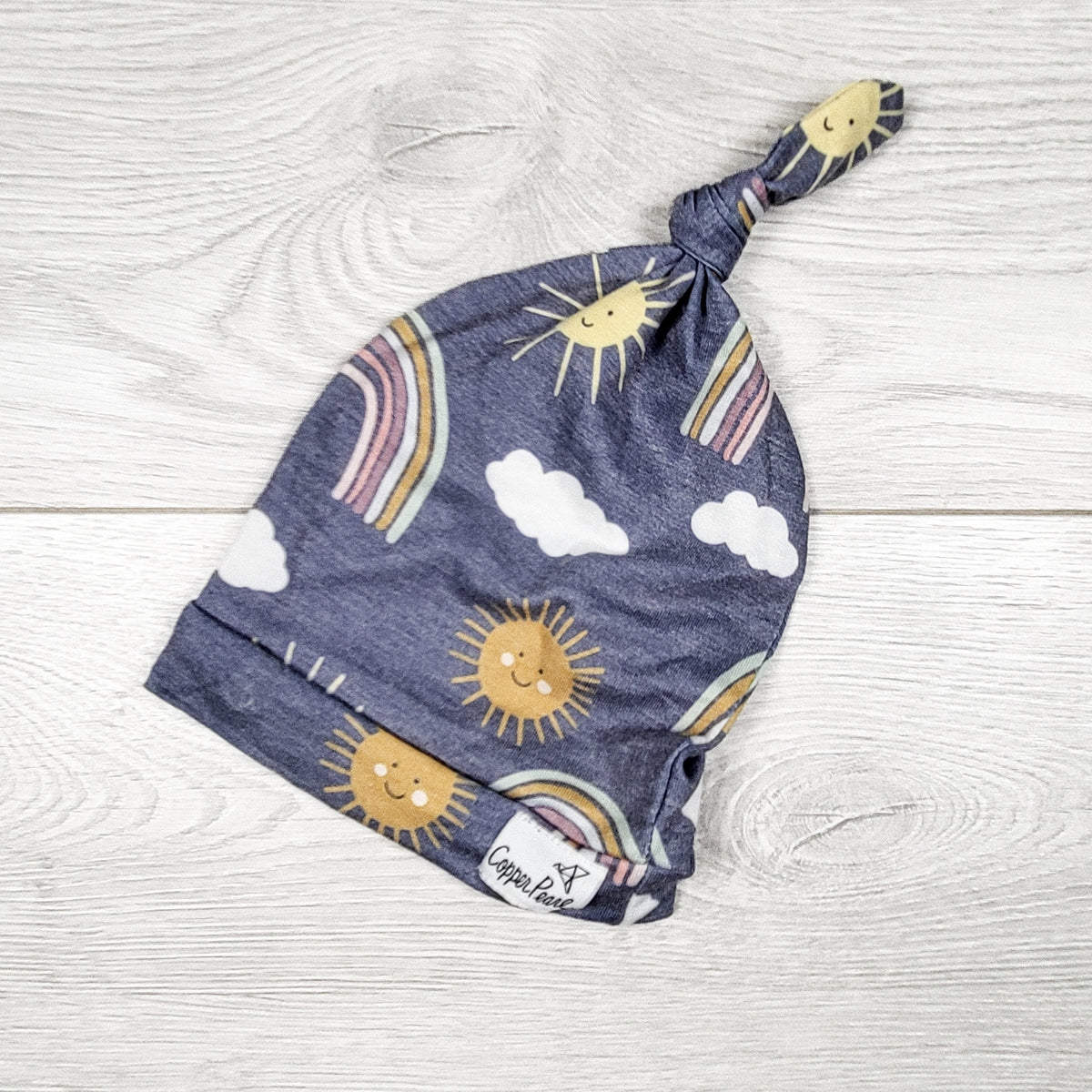 Copper Pearl blue patterned top knot hat. Newborn size