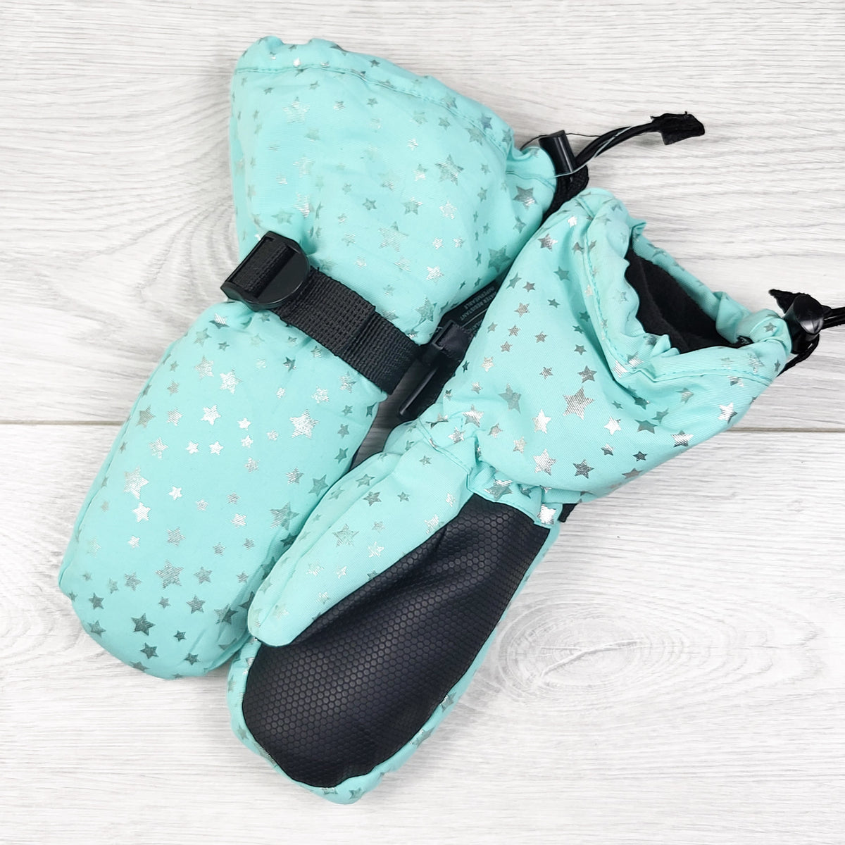 Jan and Jul mint waterproof mittens with stars. Size small (2-4 Years)