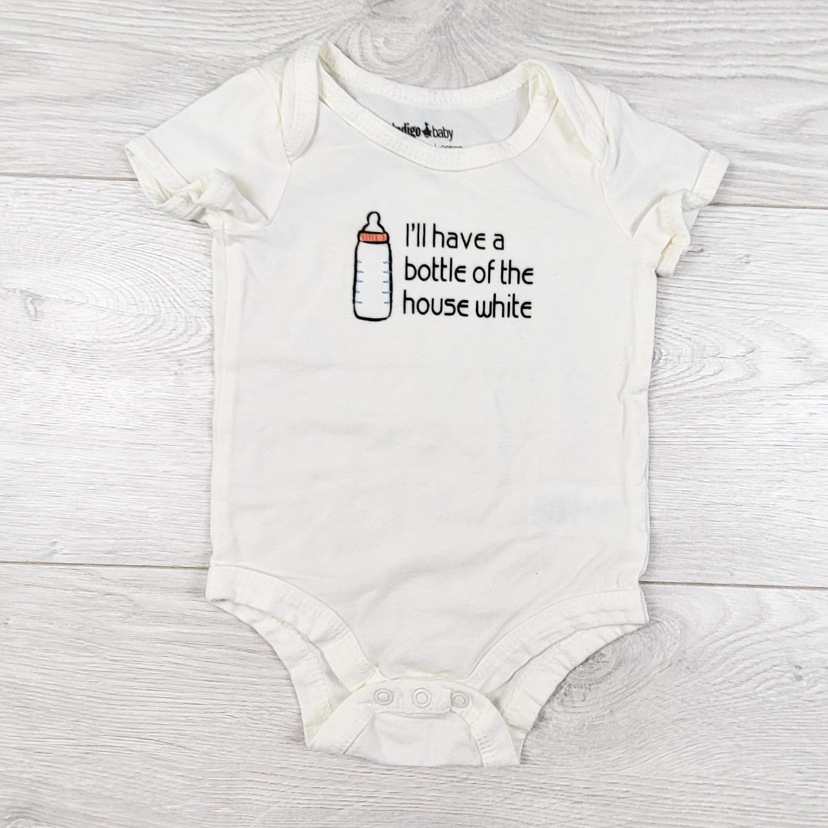 Indigo cream coloured "Bottle of the House White" bodysuit. Size 3-6 months