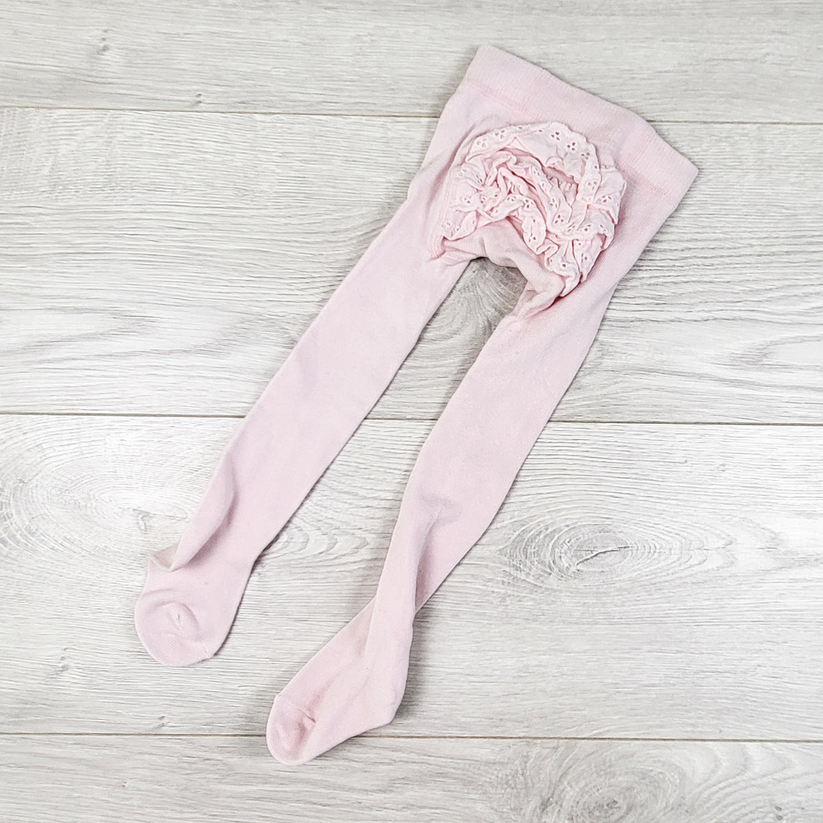 Pink tights with ruffle bum. Size 6-12 months