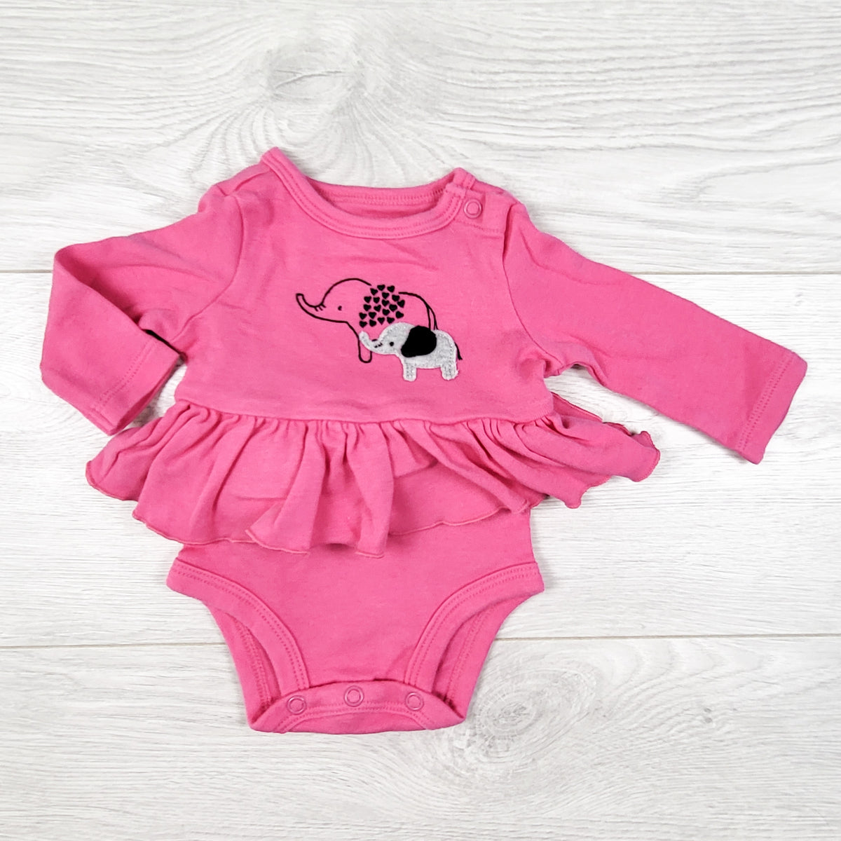 Child of Mine pink skirted bodysuit with elephants. Newborn size