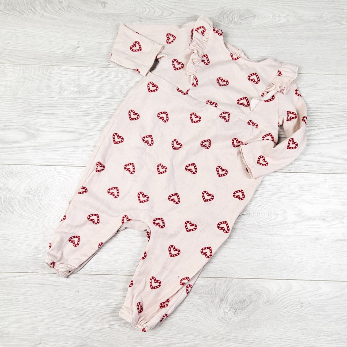 Joe Fresh pink knit romper with candy cane hearts. Size 6-12 months
