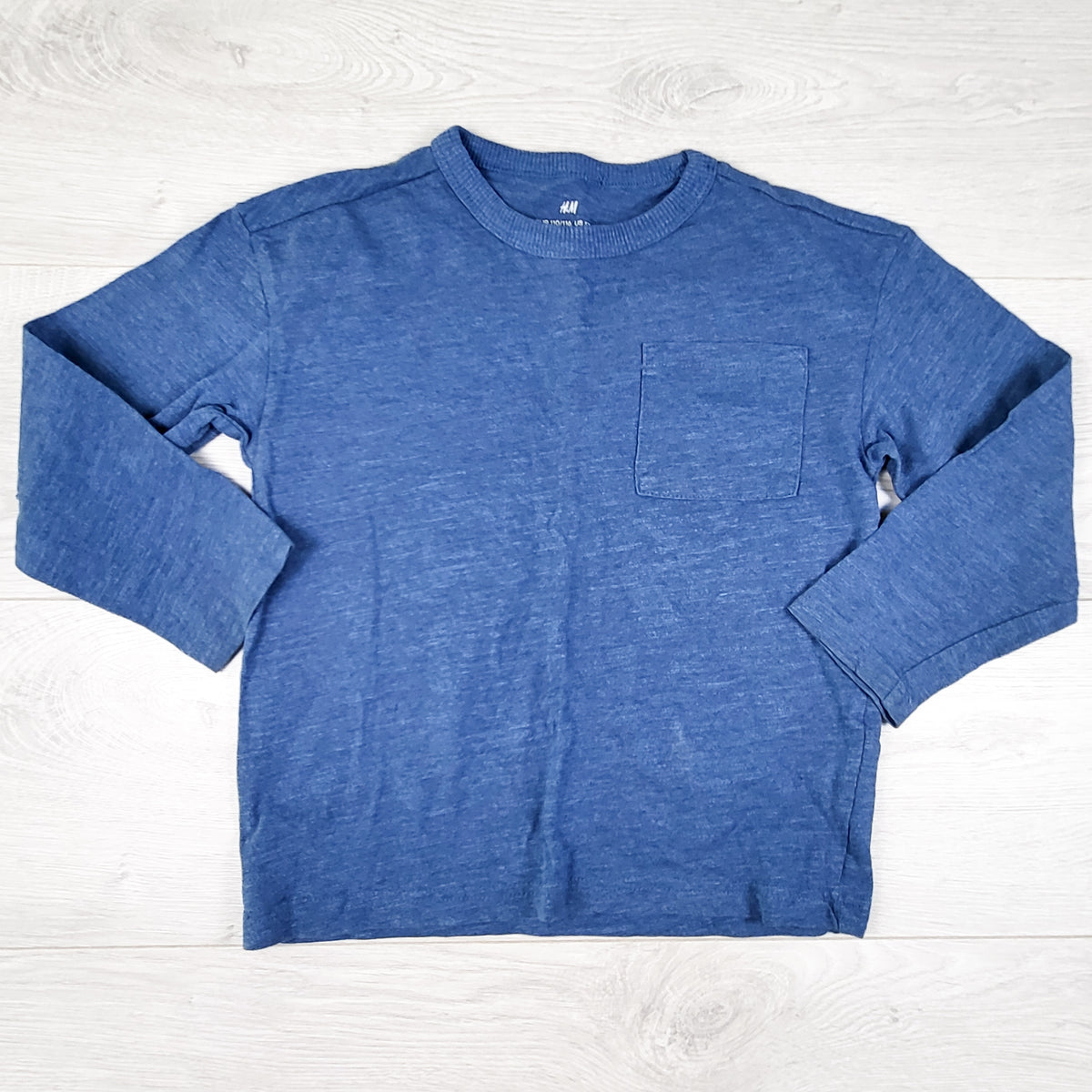 H and M blue long sleeved top. Size 4-6 Years
