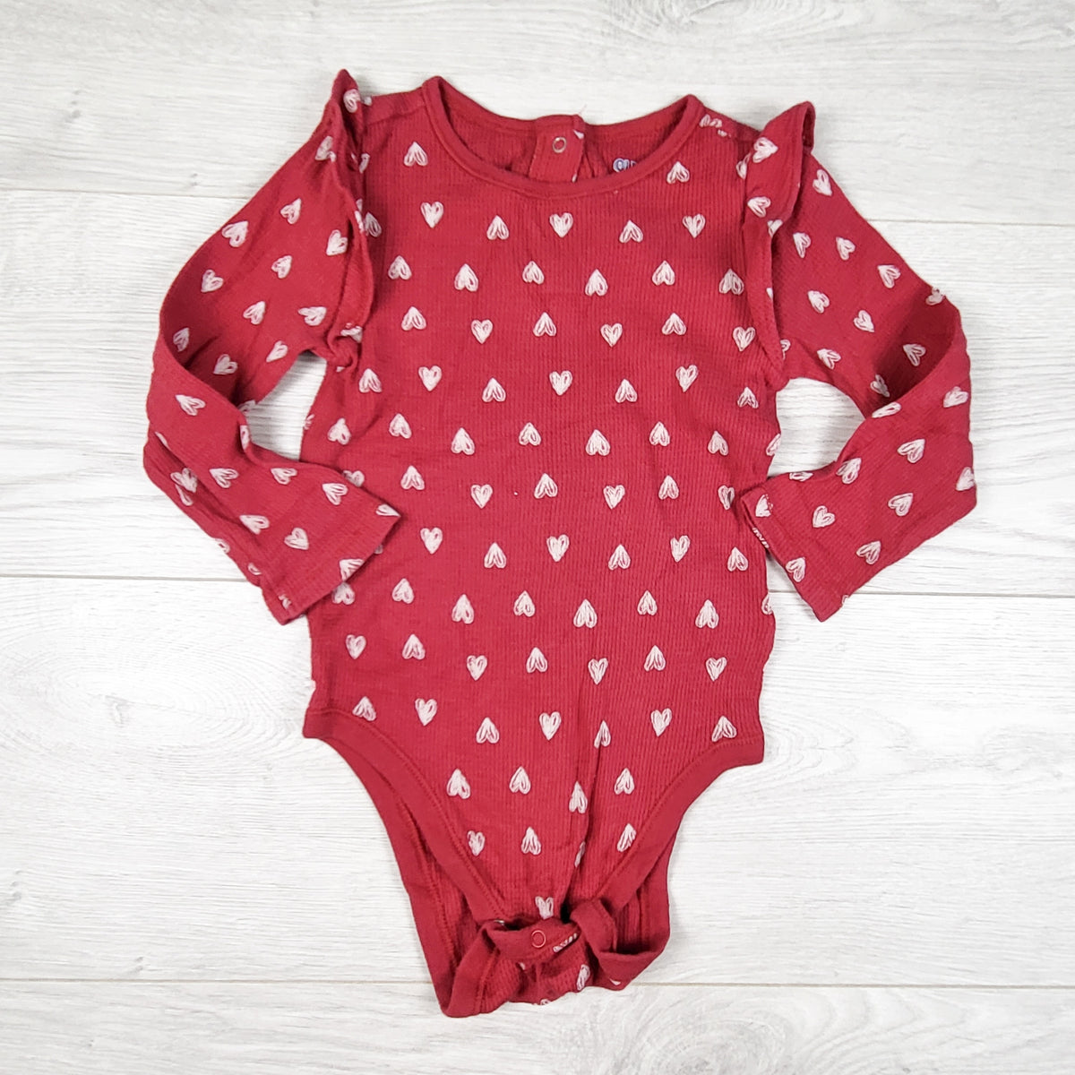 Old Navy red waffle knit bodysuit with doodle hearts. Size 18-24 months