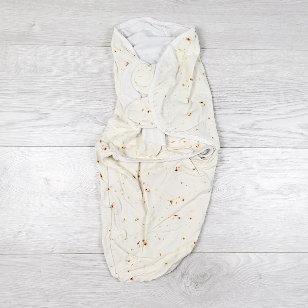 Cream abstract patterned swaddle. Approx 0-3 months