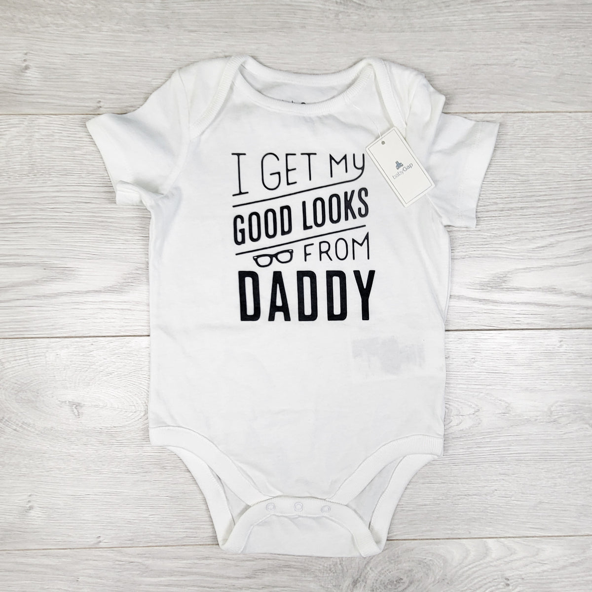 NEW - Gap white "I Get My Good Looks From Daddy" bodysuit. Size 6-12 months
