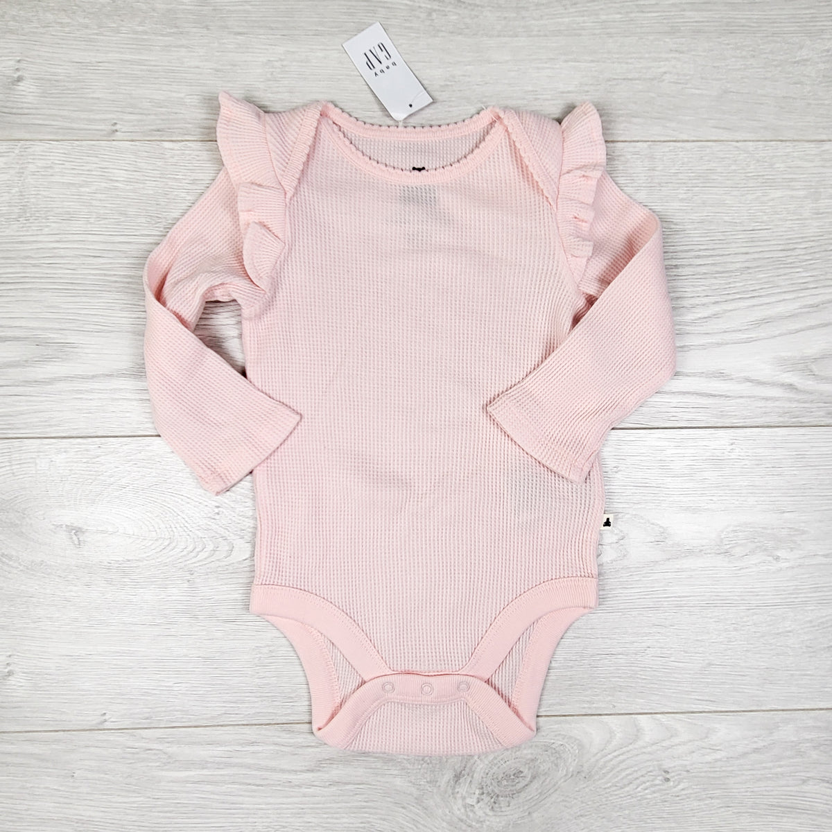 NEW - Gap pink waffle knit ruffle bodysuit. Size 6-12 months