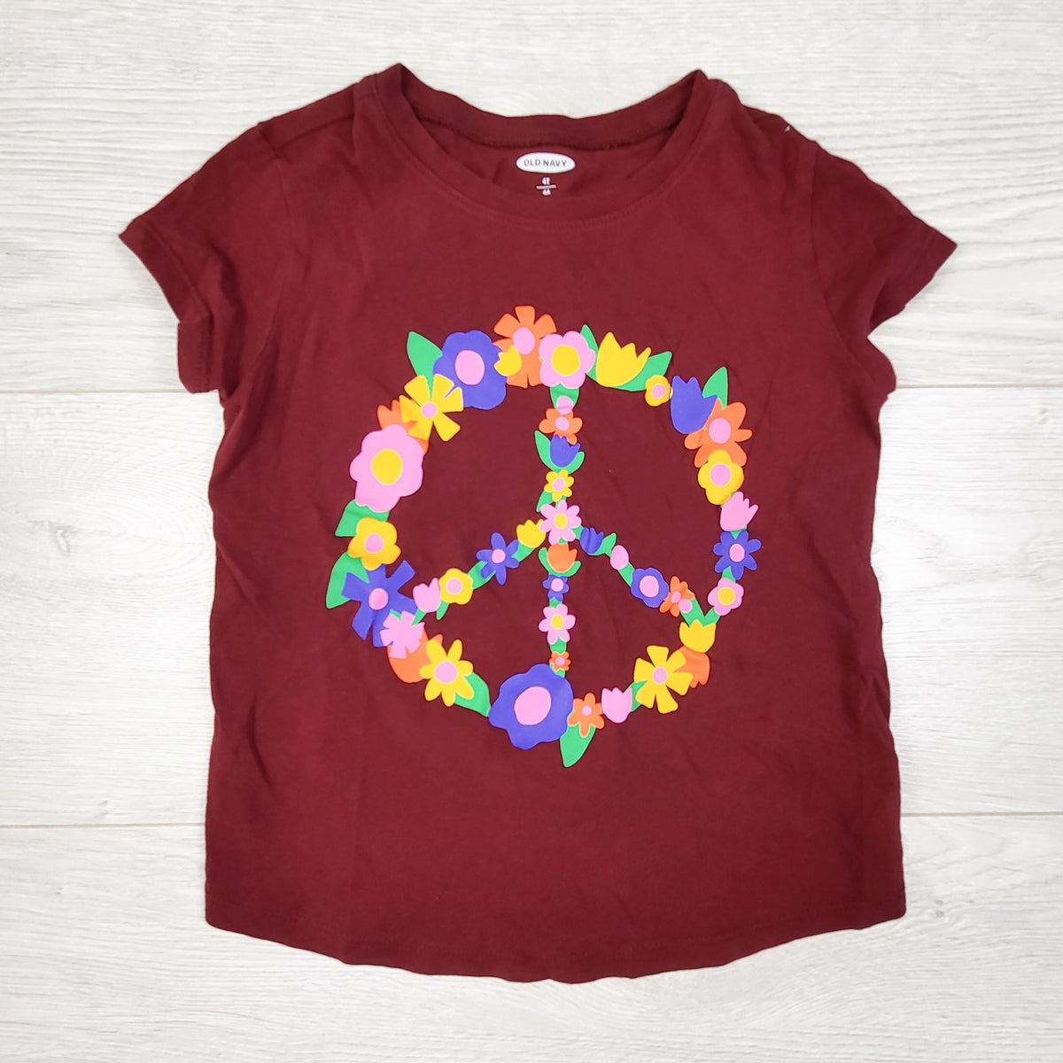 Old Navy burgundy t-shirt with floral peace sign. Size 4T