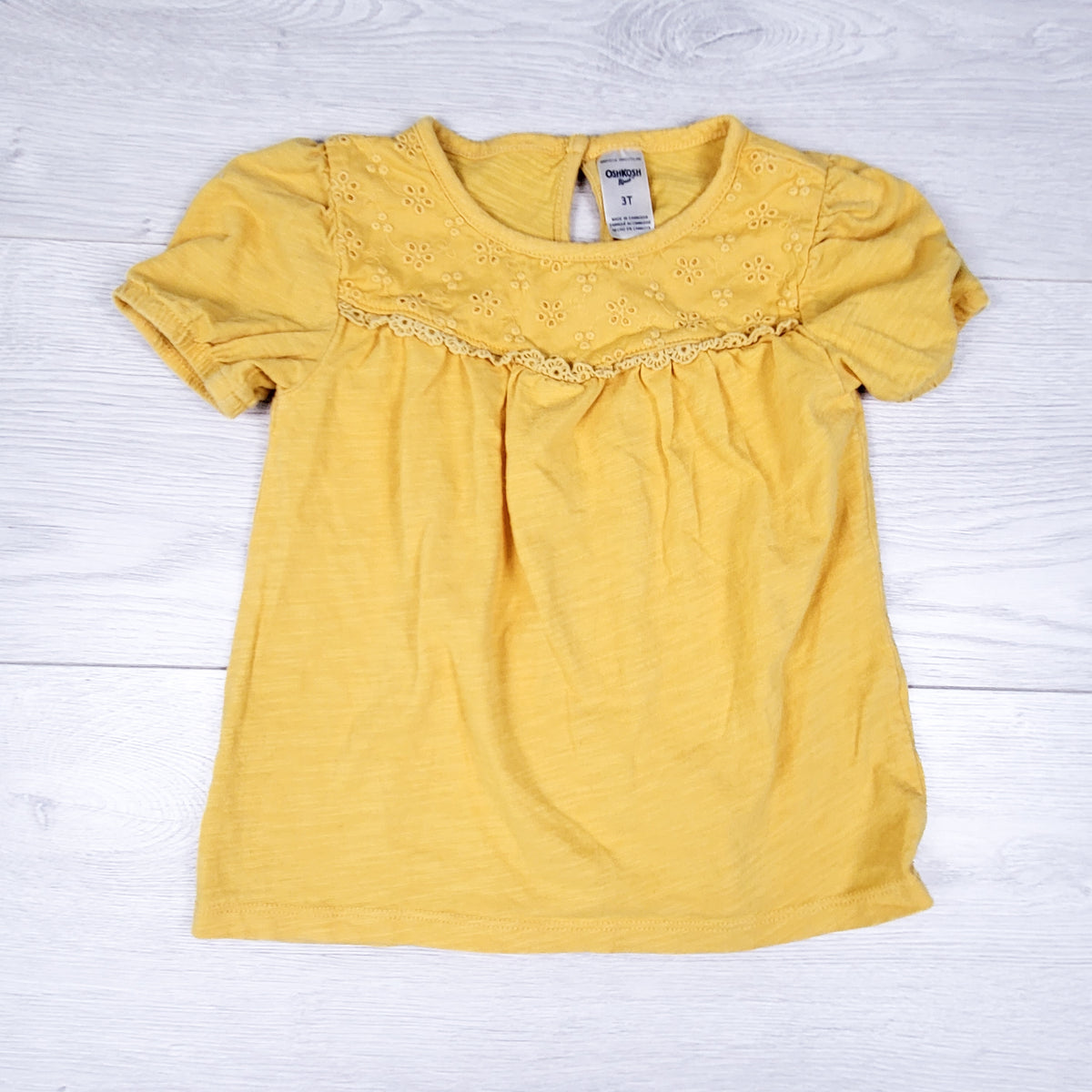 Oshkosh yellow eyelet ruffle t-shirt. Size 3T