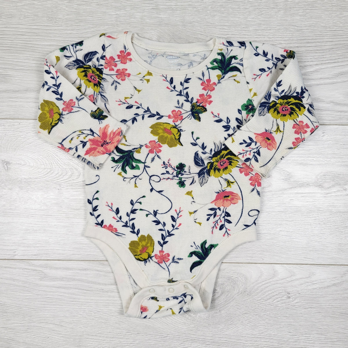 Old Navy white floral print waffle knit bodysuit. Size 12-18 months