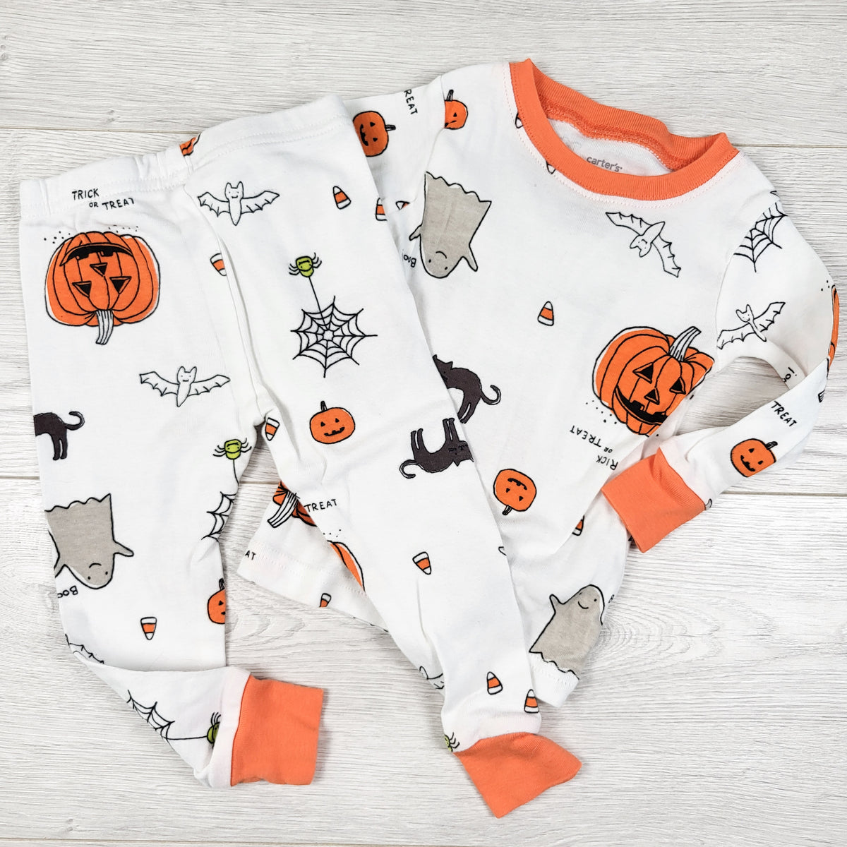Carters white and orange 2pc Halloween themed PJs. Size 12 months