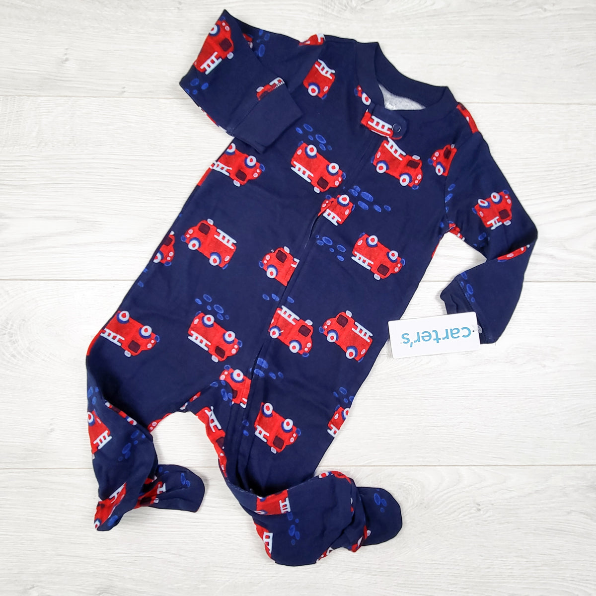 NEW - Carters navy zippered sleeper with fire trucks. Size 9 months