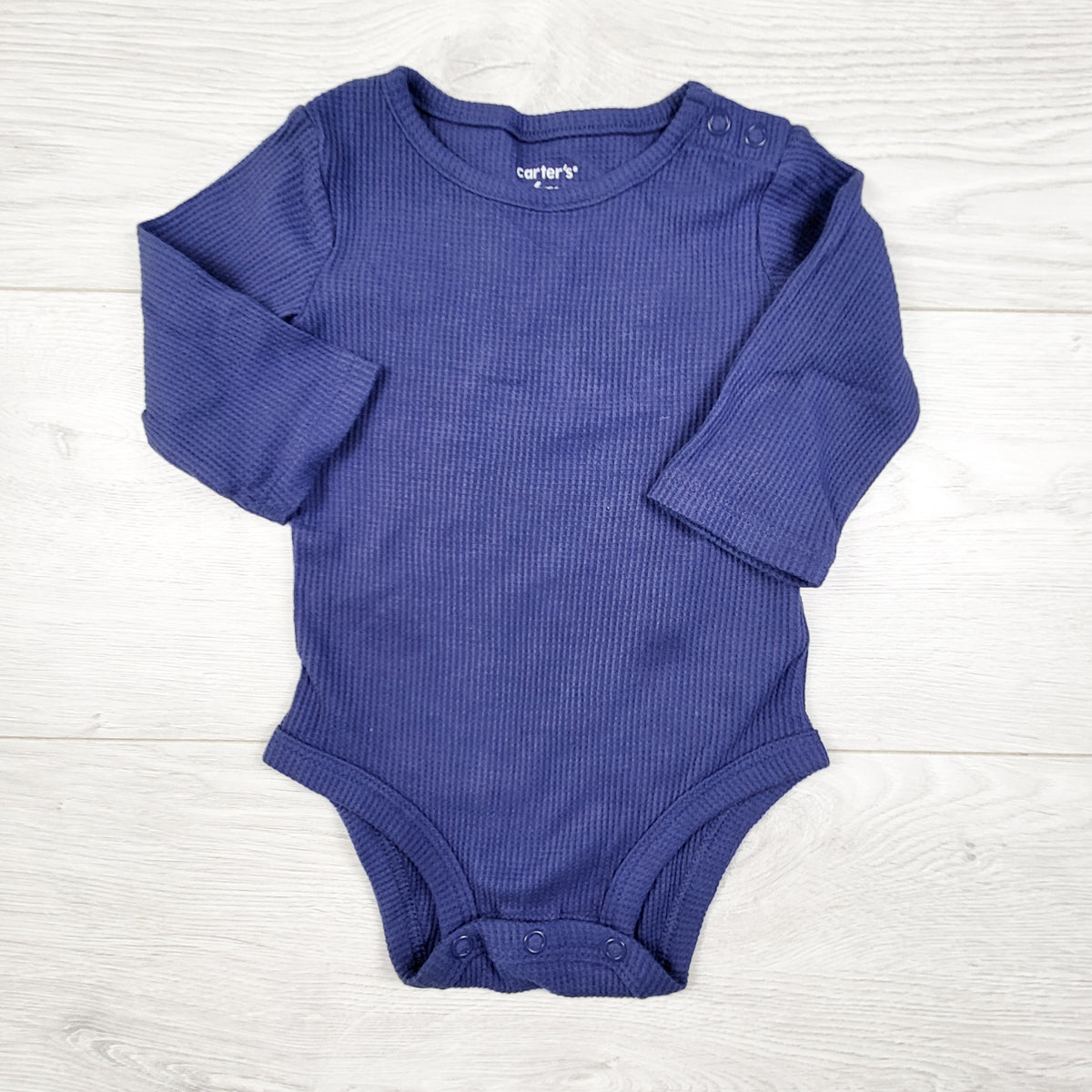 Carters blue waffle knit bodysuit. Size 6 months
