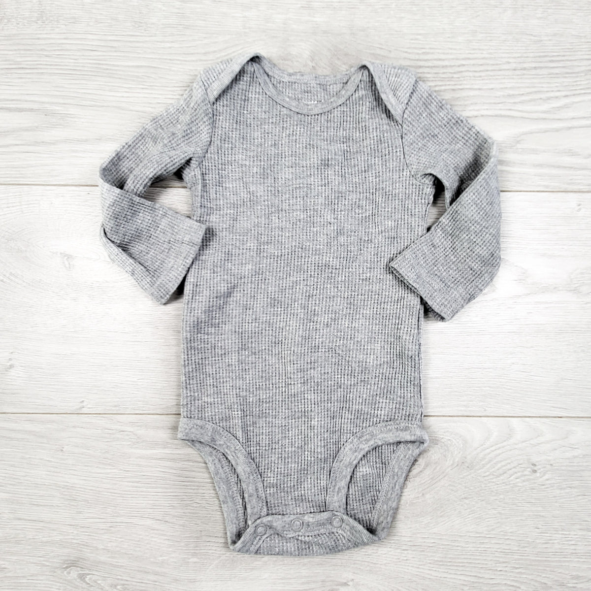 Carters grey waffle knit bodysuit. Size 6 months