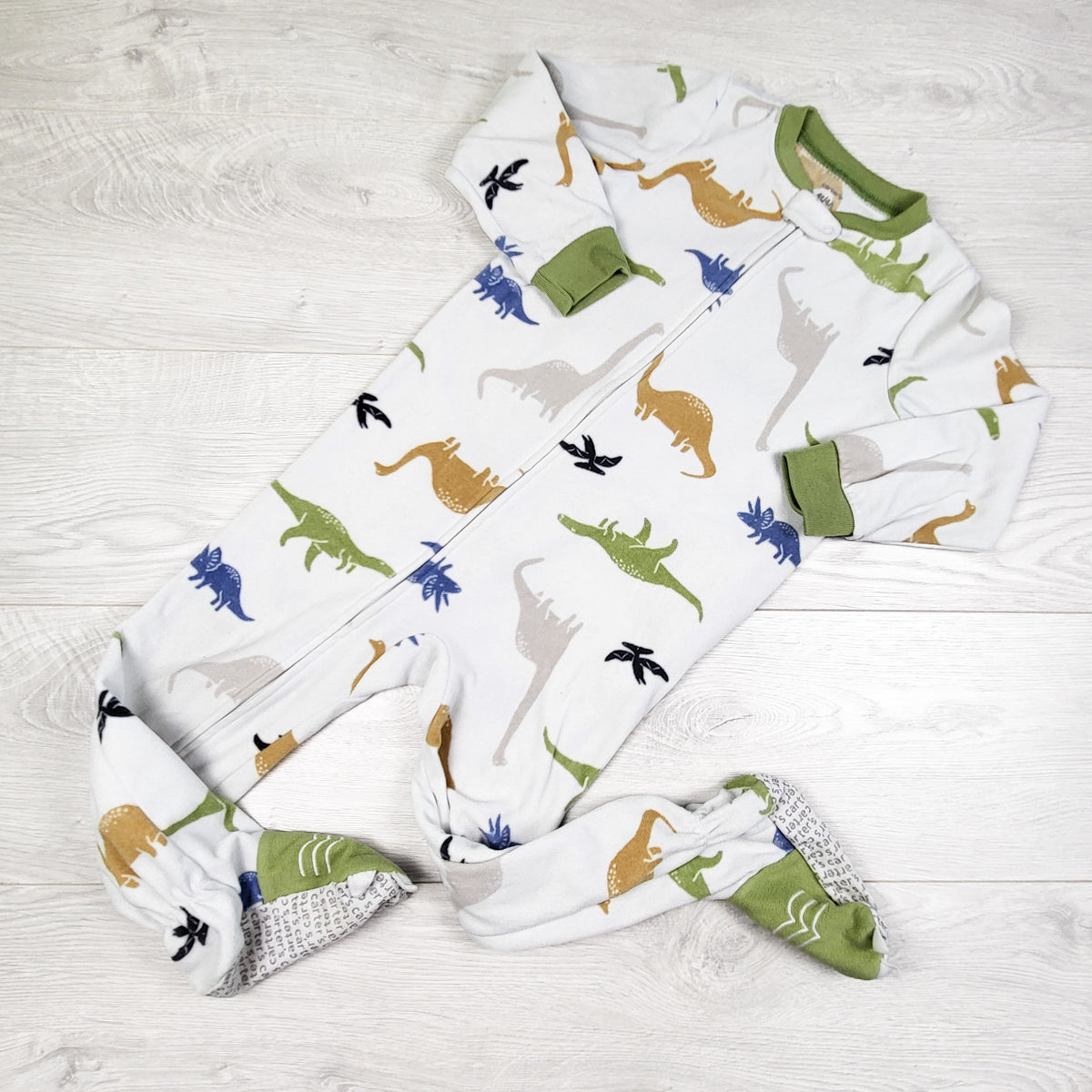 Carters white zippered fleece sleeper with dinosaurs. Size 4T