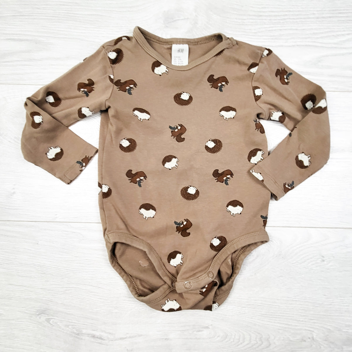 H and M Brown Bodysuit with Hedgehogs. Size 9-12 Months