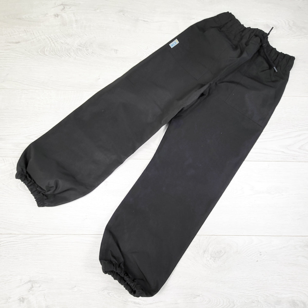 Jan and Jul Black Single Layer Rain Pants. Size 6-8 Years