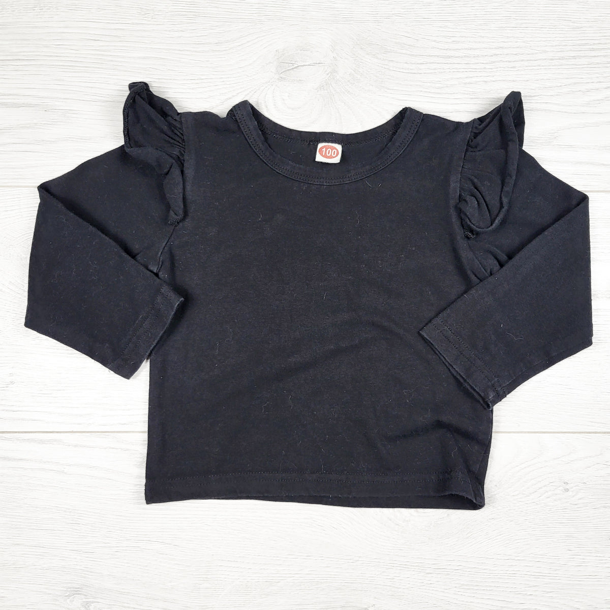 Unbranded black long sleeve ruffle top. Size 2T