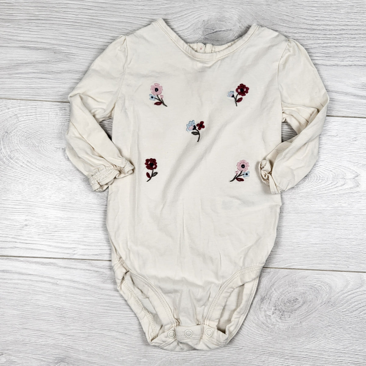 Carters beige floral embroidered bodysuit. Size 6 months