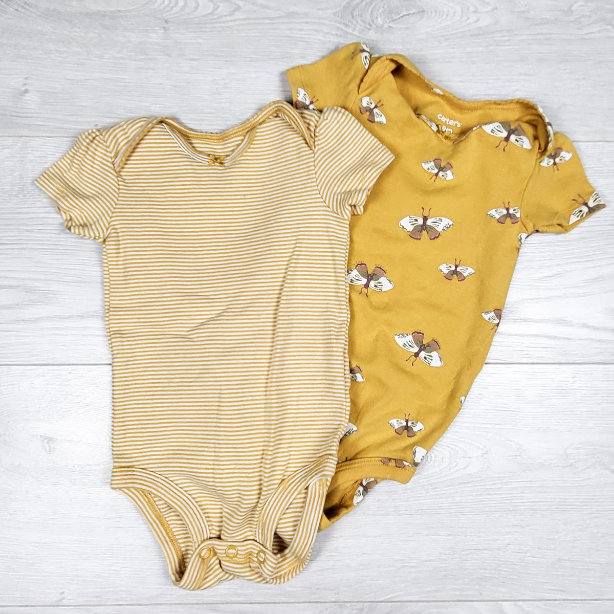 Carters yellow 2pc bodysuit with moths. Size 9 months