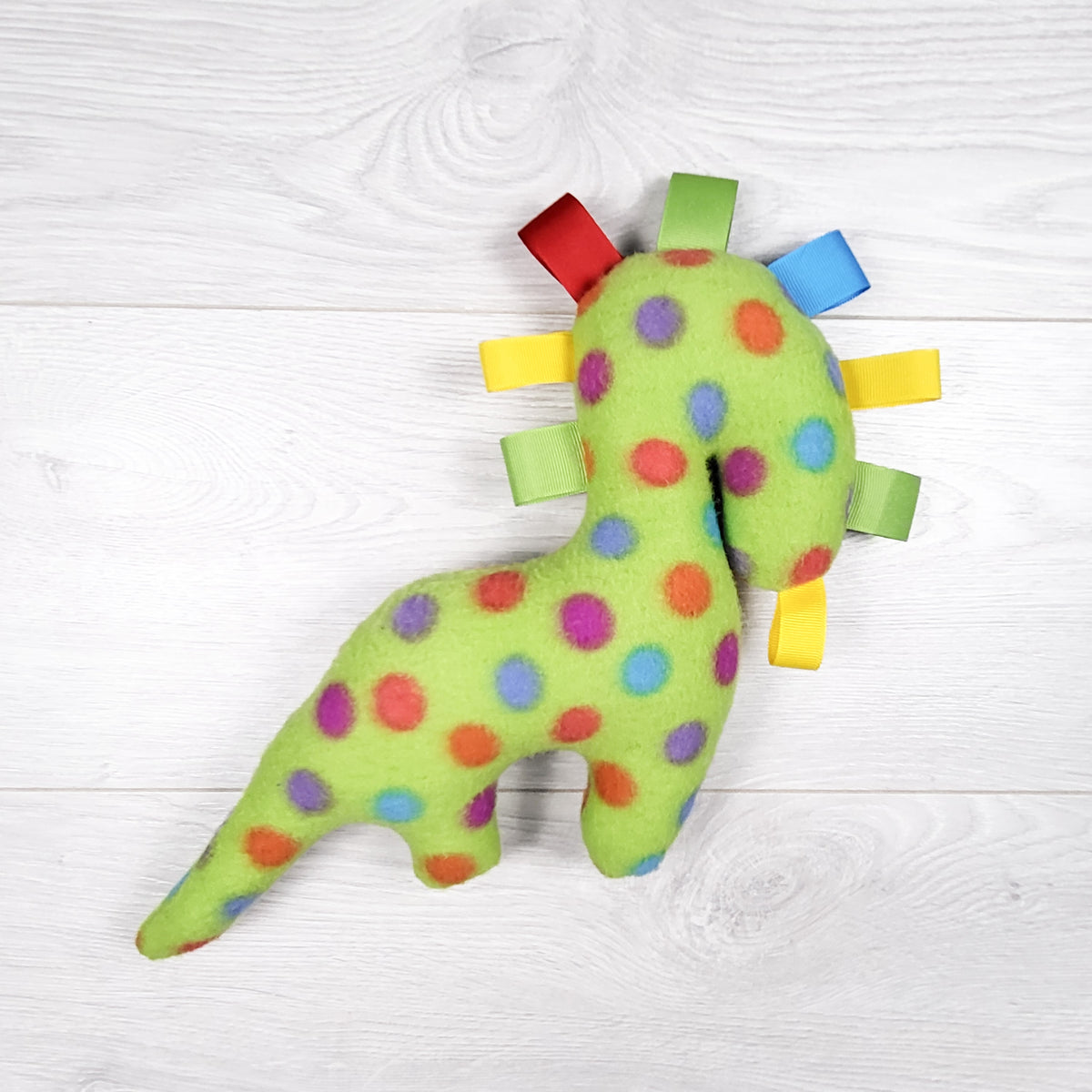 Handmade fleece polka-dot dinosaur "Taggie" sensory plush