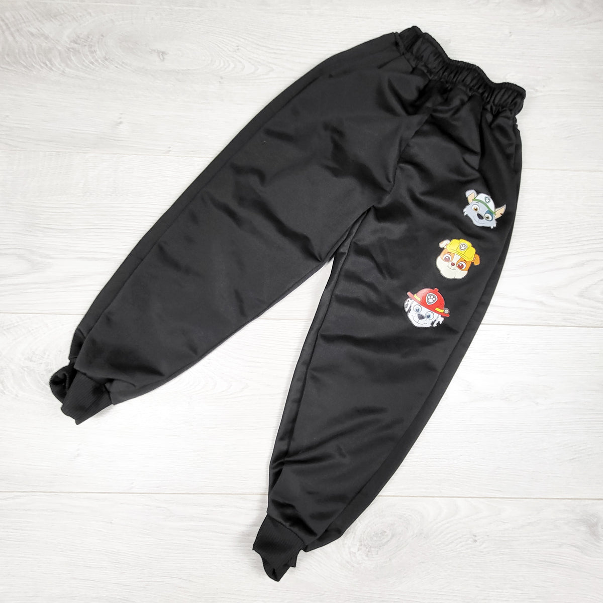 Black unbranded Paw Patrol active pants. Approx 3T
