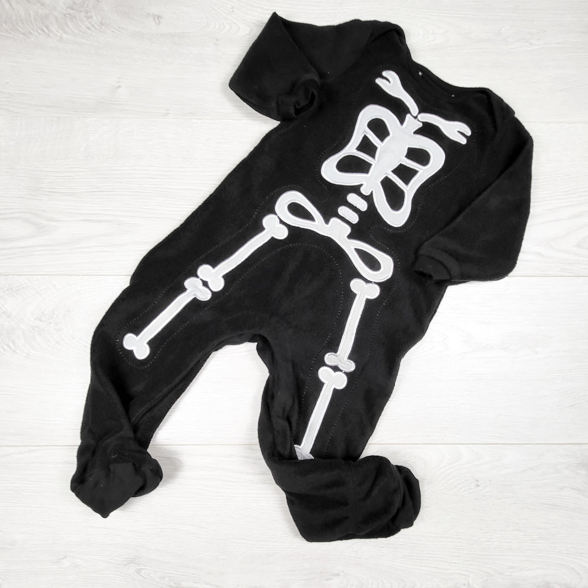 Black fleece skeleton sleeper. Approx 12-18 months