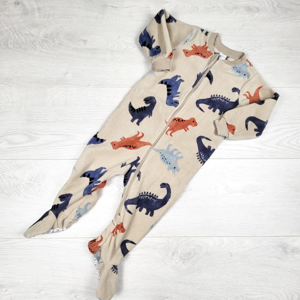 Pekkle beige zippered fleece sleeper with dinosaurs. Size 12 months