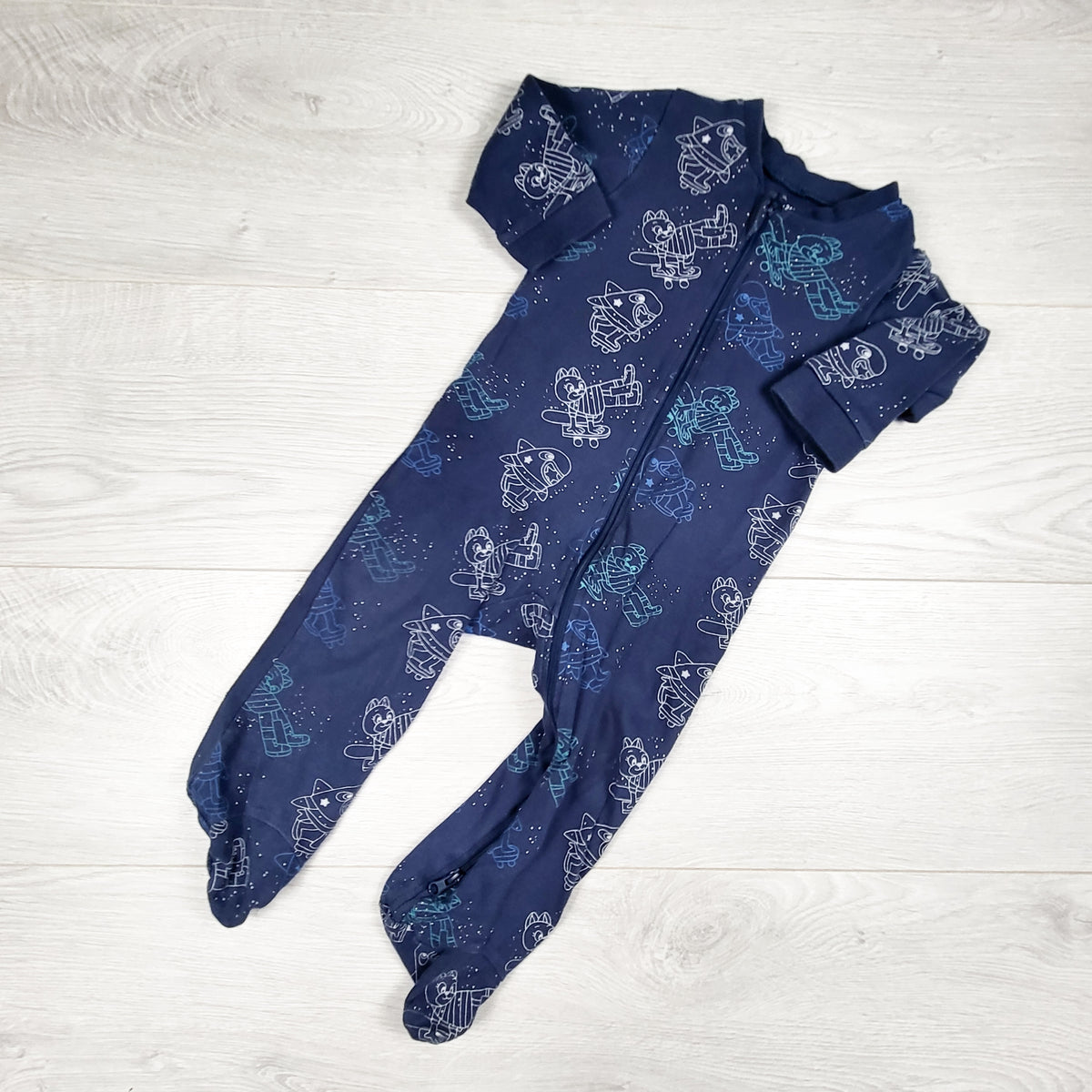 Blue zippered cotton sleeper with space theme. Size 12 months