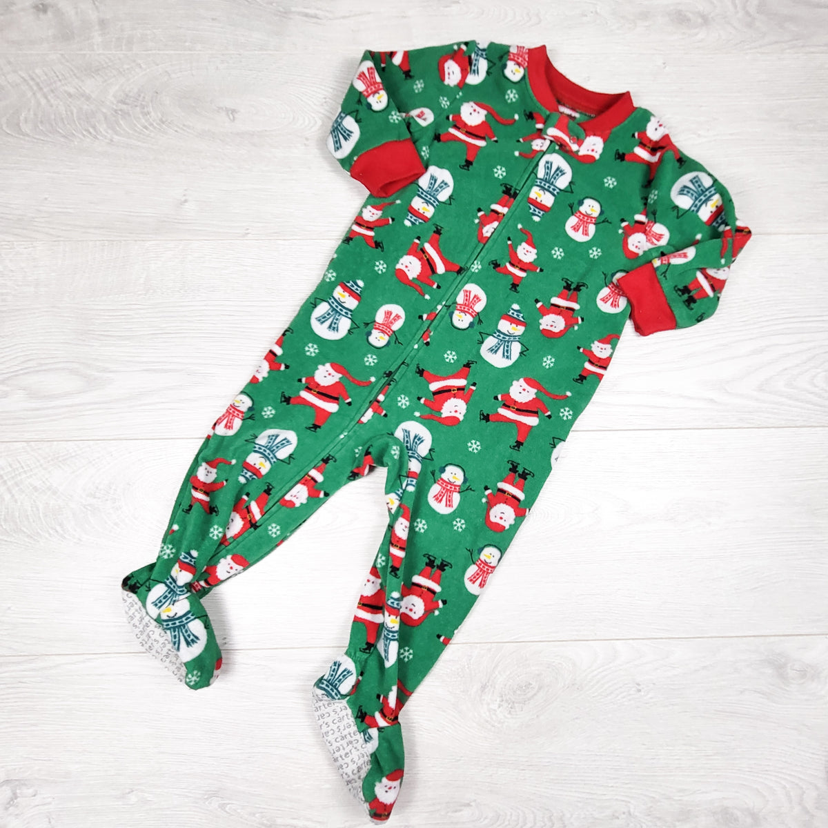 Carters green zippered fleece sleeper with Santa. Size 12 months