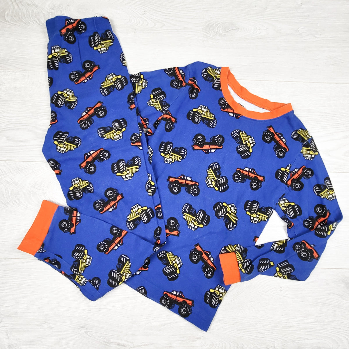 Pekkle blue 2pc PJs with monster trucks. Size 7/8