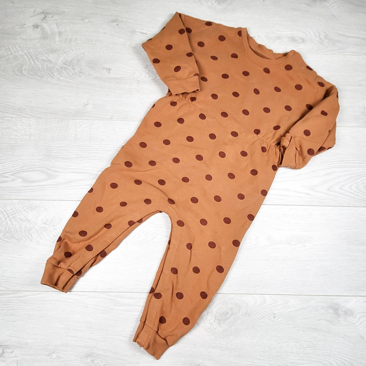 Rise Little Earthling pumpkin coloured fleecy lined lined polka dot romper. Size 18-24 months